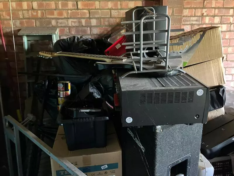 Garage waste being removed from a property in Sutton, St Helens